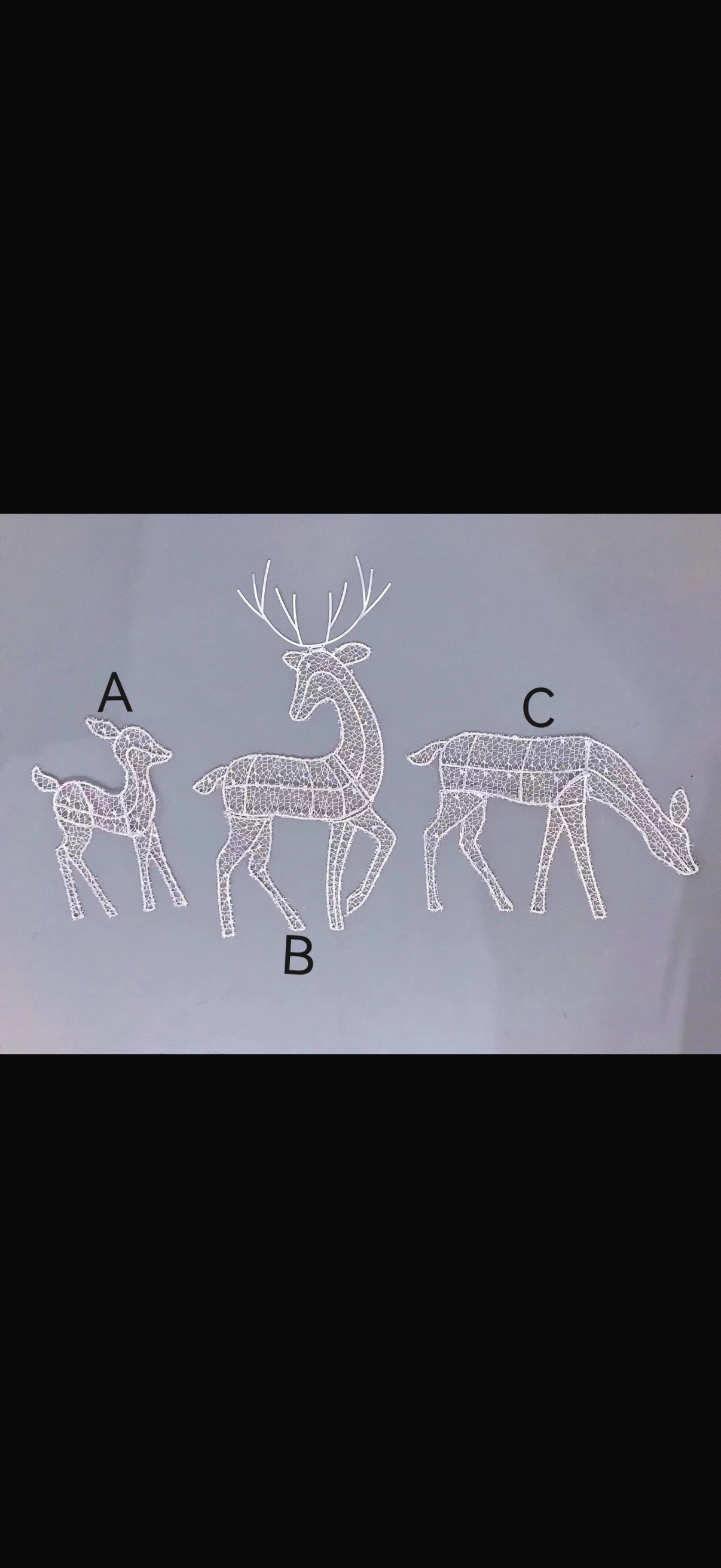 Gloeiende ijzeren kunstwerk met eland en rendier als kerstversiering